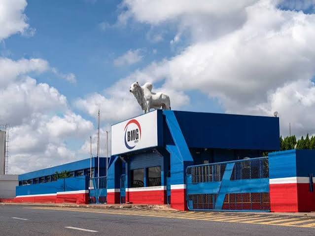 BMG Foods processing facility exterior with company gate and signage